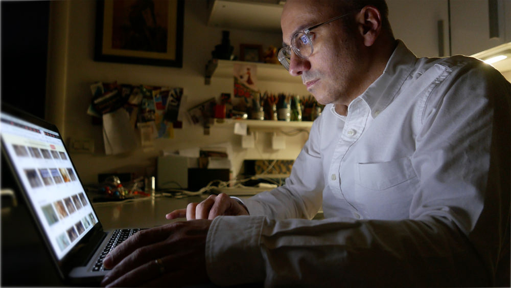 Man On Laptop Searching Images For Porn