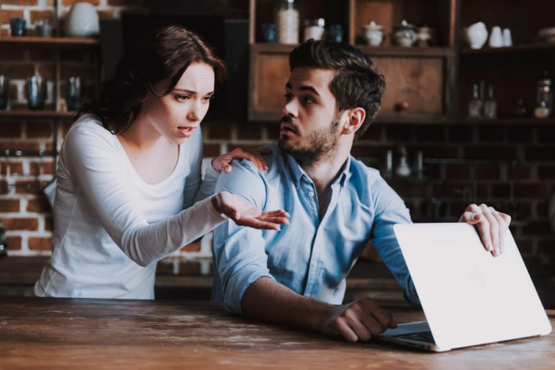 Woman Confronting Man On Laptop For Porn Addiction